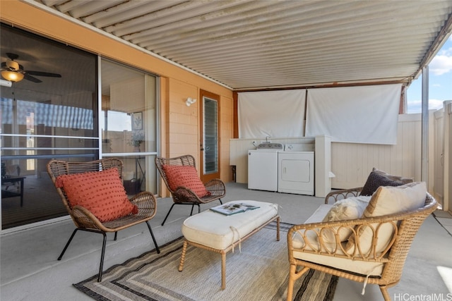 view of patio / terrace featuring separate washer and dryer and a balcony