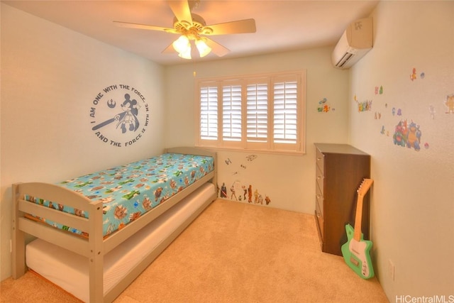 carpeted bedroom with a wall unit AC and ceiling fan