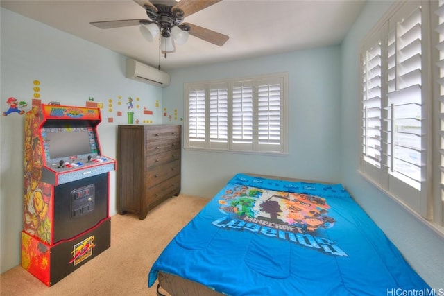 bedroom with an AC wall unit, ceiling fan, and light carpet