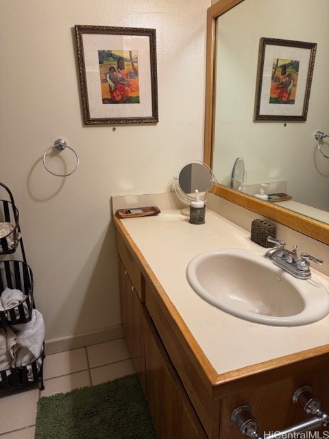 bathroom with tile patterned floors and vanity