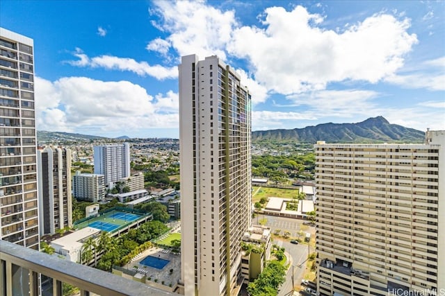 property's view of city featuring a mountain view