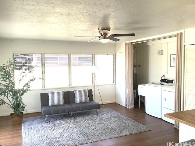 unfurnished living room with dark hardwood / wood-style floors, ceiling fan, separate washer and dryer, and a textured ceiling