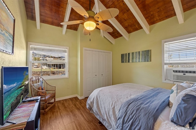 bedroom featuring ceiling fan, wooden ceiling, lofted ceiling with beams, a closet, and light wood-type flooring