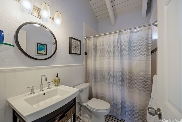 bathroom with a shower with curtain, vanity, lofted ceiling, and toilet