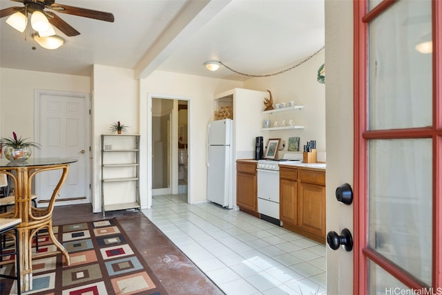 kitchen featuring light tile patterned floors, white appliances, and ceiling fan