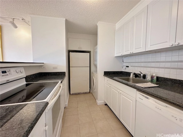 kitchen with white cabinetry, tasteful backsplash, a textured ceiling, white appliances, and light tile patterned floors