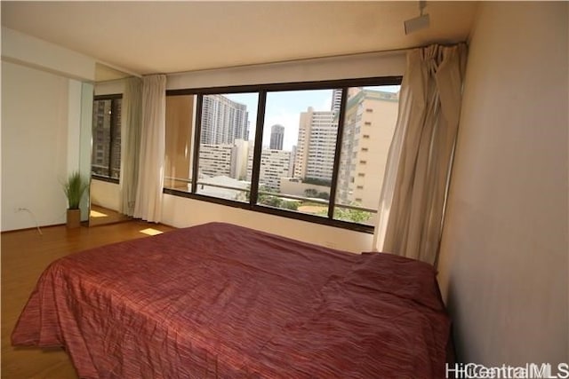 bedroom featuring hardwood / wood-style flooring