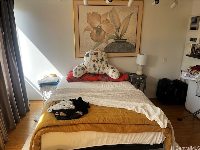 bedroom featuring wood-type flooring