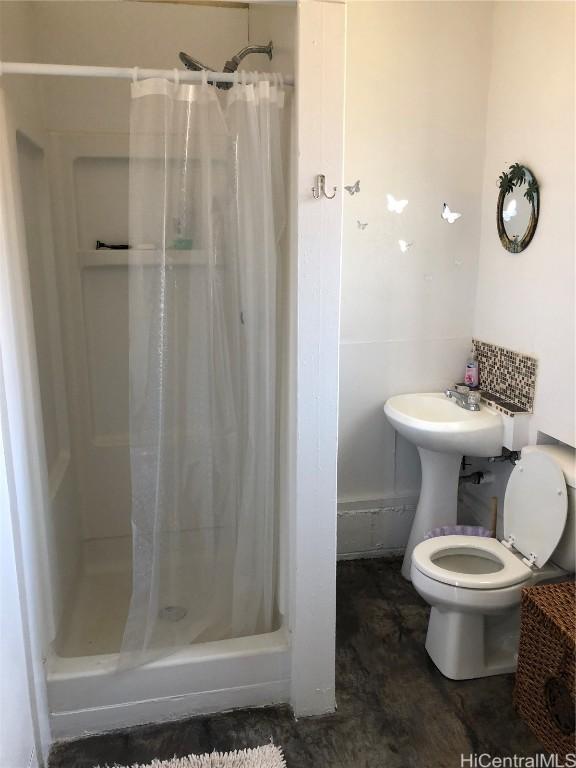 bathroom with toilet and walk in shower