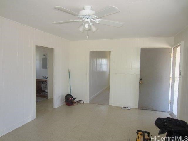 91-507 Ewa Beach Rd, Ewa Beach, HI 96706 - empty room with a ceiling fan, plenty of natural light, and tile patterned floors