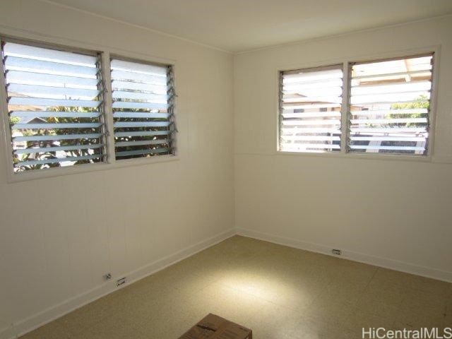 91-507 Ewa Beach Rd, Ewa Beach, HI 96706 - empty room with healthy amount of natural light and tile patterned floors