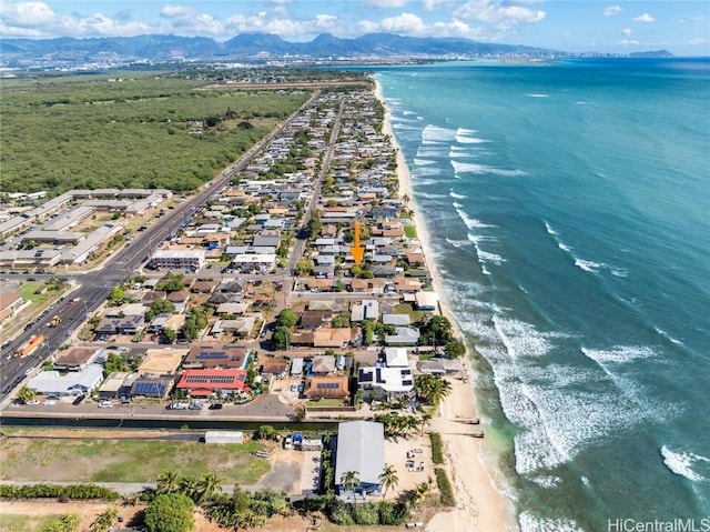 aerial view with a water and mountain view and a beach view