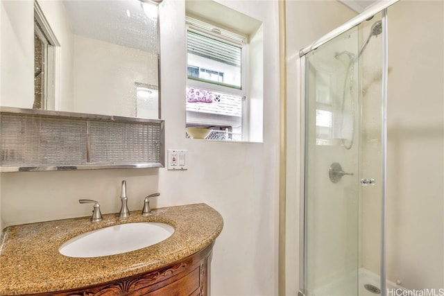 bathroom featuring vanity and walk in shower