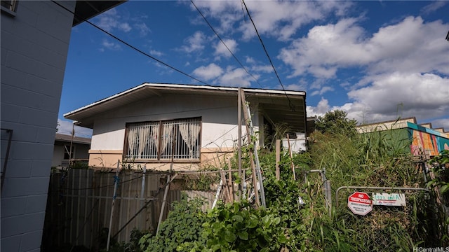 1422 Pua Ln Unit A, Honolulu, HI 96817 - view of side of home featuring concrete block siding