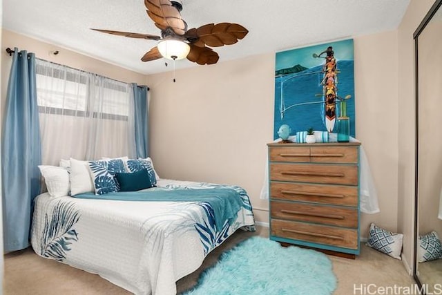 carpeted bedroom with ceiling fan