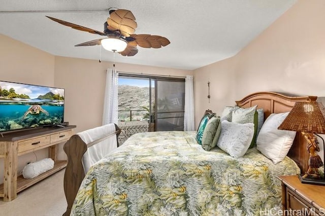 carpeted bedroom featuring ceiling fan and access to exterior