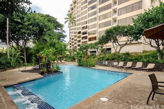 community pool with a patio area