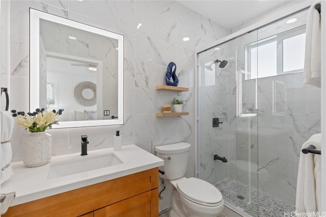 bathroom featuring walk in shower, backsplash, toilet, vanity, and tile walls