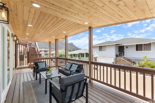 deck with a mountain view and an outdoor hangout area