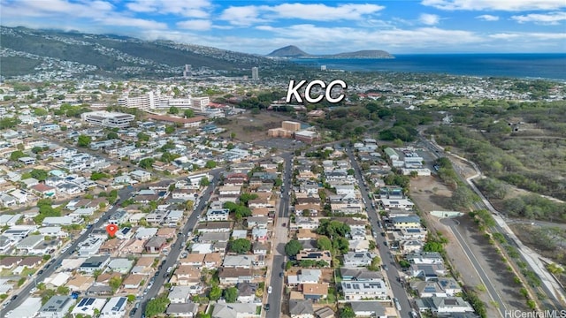 aerial view featuring a water and mountain view