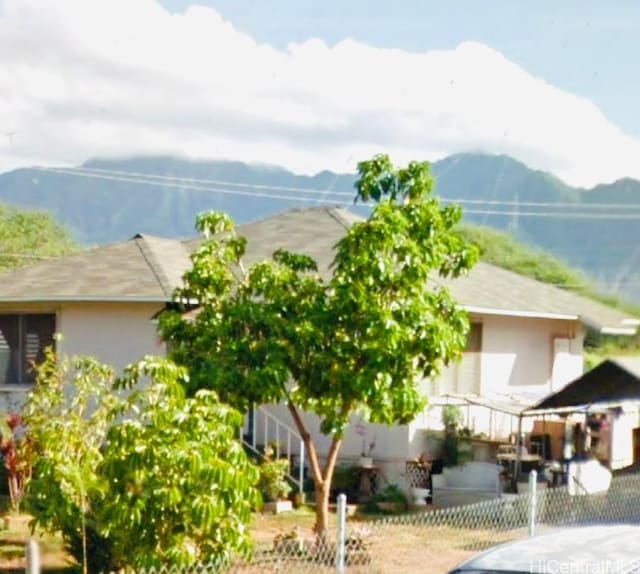 view of side of property with a mountain view