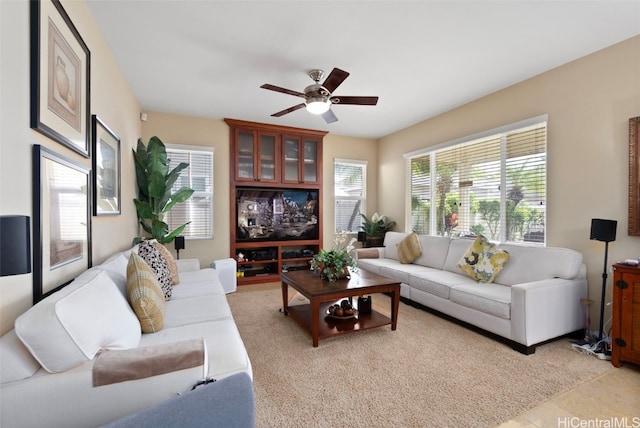 living room with ceiling fan and light tile patterned floors