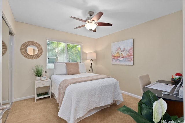 bedroom with light carpet and ceiling fan