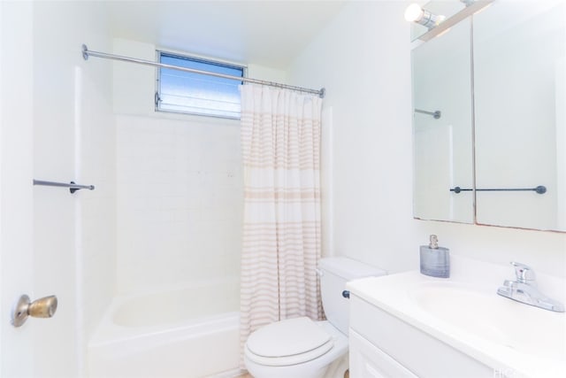 full bathroom featuring shower / bath combo, vanity, and toilet