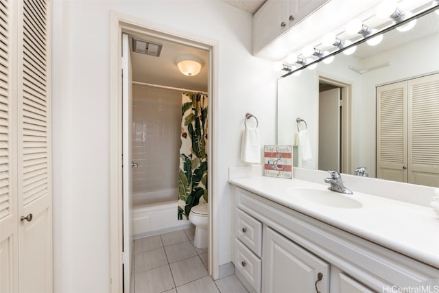 full bathroom featuring toilet, shower / bath combination with curtain, vanity, and tile patterned floors