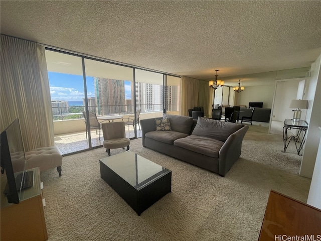 living room with carpet flooring, floor to ceiling windows, a textured ceiling, and an inviting chandelier