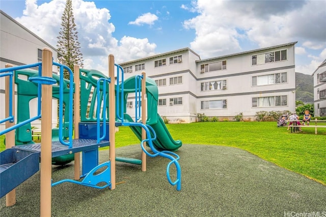 view of playground featuring a lawn