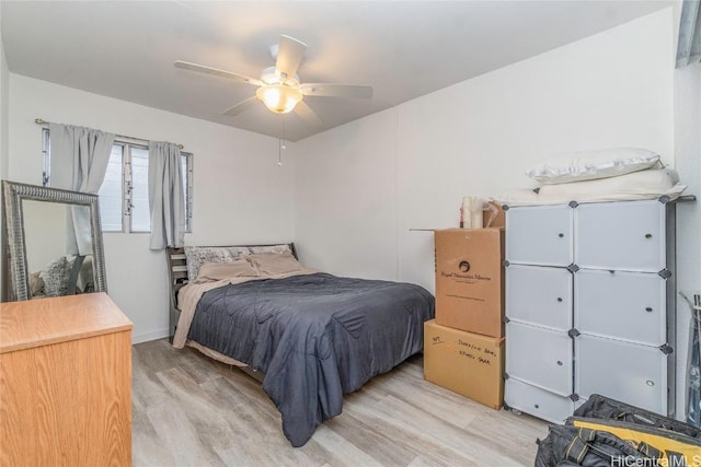 bedroom featuring wood finished floors and a ceiling fan