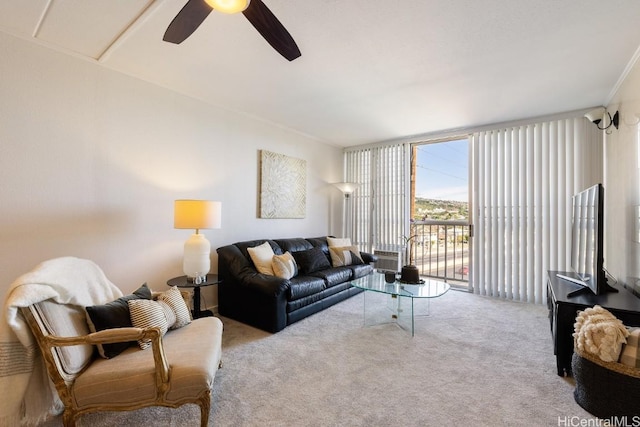 carpeted living room featuring ceiling fan