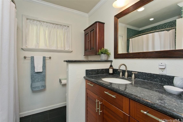 bathroom with tile patterned flooring, crown molding, and vanity