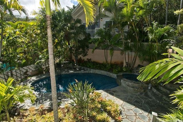 view of pool featuring a hot tub