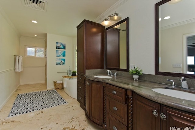 bathroom featuring vanity, tile patterned flooring, and ornamental molding