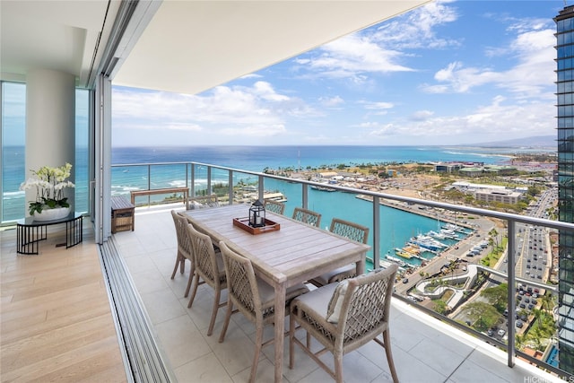 balcony featuring a water view