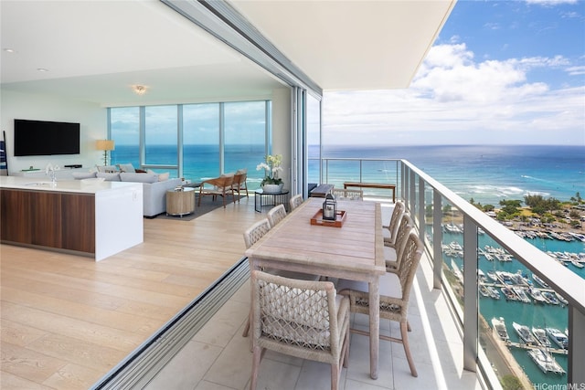 balcony featuring a water view