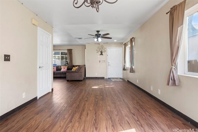 interior space featuring ceiling fan and dark hardwood / wood-style flooring