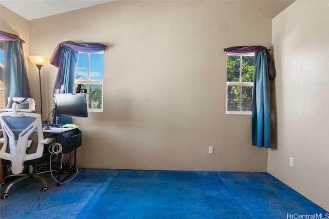 interior space featuring carpet floors and lofted ceiling