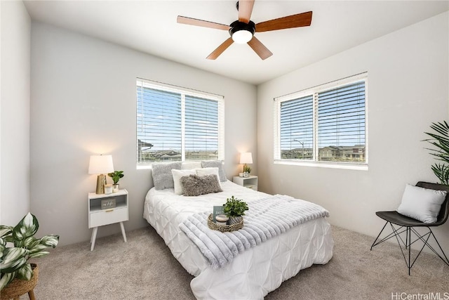 bedroom featuring ceiling fan and light colored carpet