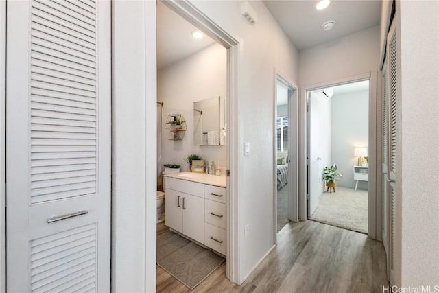 hallway featuring light hardwood / wood-style flooring