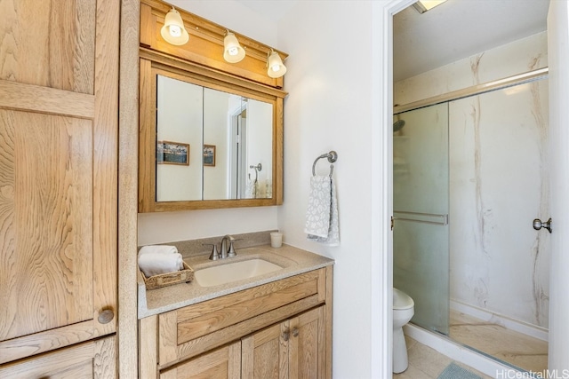 bathroom with toilet, an enclosed shower, and vanity