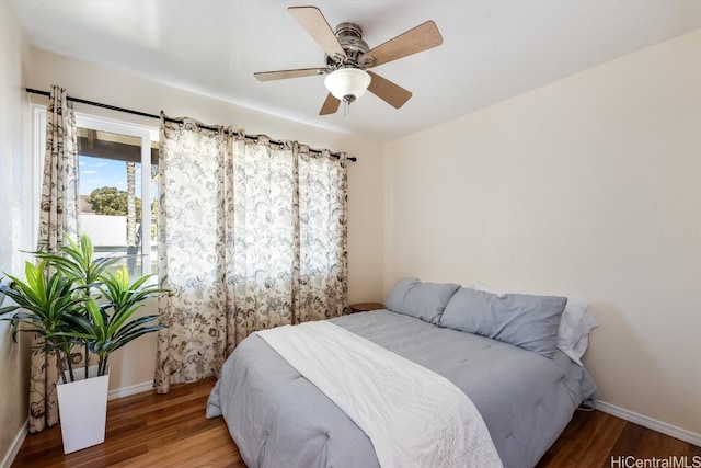 bedroom with wood-type flooring and ceiling fan