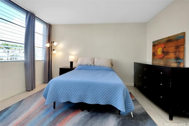 bedroom featuring light tile patterned floors