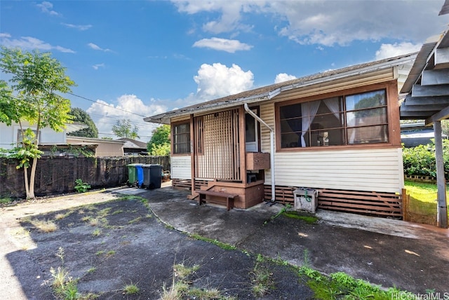 exterior space with entry steps and fence