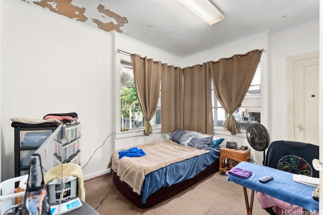 bedroom featuring carpet floors and crown molding