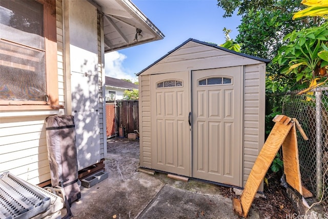 view of shed featuring a fenced backyard
