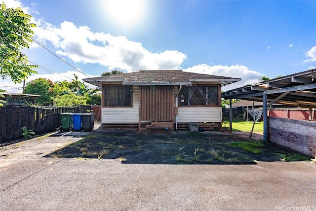 view of front of home featuring a carport