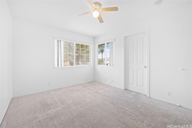 unfurnished room featuring carpet floors and ceiling fan